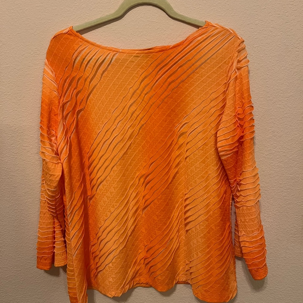 Bright orange light weight long sleeved top
